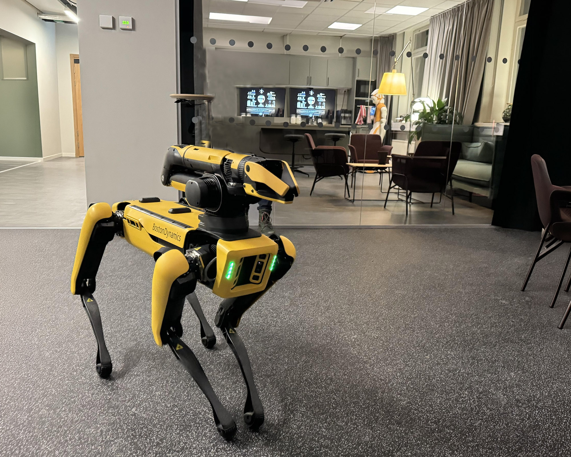 BostonDynamics robot dog infront of the KTH IRL smart kitchen